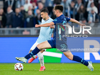 Mattia Zaccagni of SS Lazio and Martim Fernandes of FC Porto compete for the ball during the UEFA Europa League 2024/25 League Phase MD4 mat...