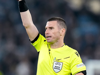 Referee Georgi Kabakov shows a yellow card during the UEFA Europa League 2024/25 League Phase MD4 match between SS Lazio and FC Porto at Sta...