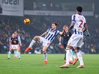 Jayson Molumby of WBA attempts to clear the ball overhead during the Sky Bet Championship match between West Bromwich Albion and Burnley at...