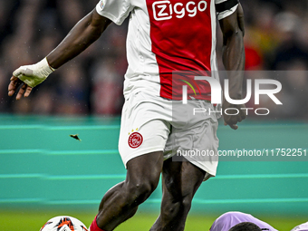 AFC Ajax Amsterdam forward Brian Brobbey and Maccabi Tel Aviv goalkeeper Roi Mishpati play during the match between Ajax and Maccabi Tel Avi...