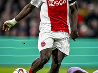 AFC Ajax Amsterdam forward Brian Brobbey and Maccabi Tel Aviv goalkeeper Roi Mishpati play during the match between Ajax and Maccabi Tel Avi...