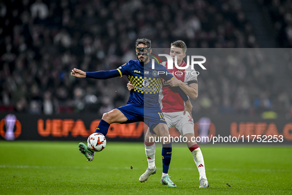 Maccabi Tel Aviv midfielder Sagiv Jehezkel and AFC Ajax Amsterdam defender Anton Gaaei play during the match between Ajax and Maccabi Tel Av...