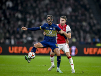 Maccabi Tel Aviv midfielder Sagiv Jehezkel and AFC Ajax Amsterdam defender Anton Gaaei play during the match between Ajax and Maccabi Tel Av...