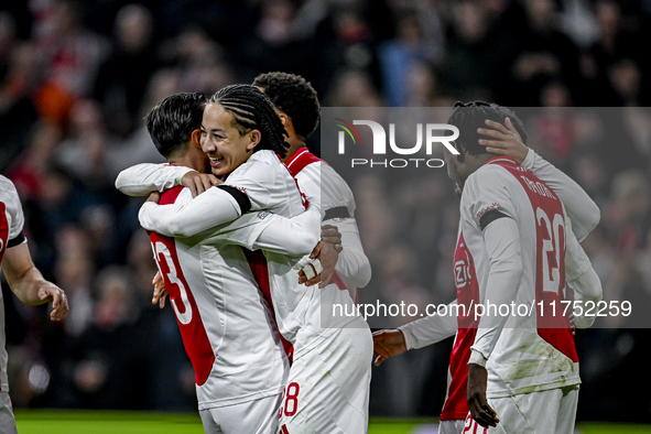 AFC Ajax Amsterdam forward Steven Berghuis and AFC Ajax Amsterdam midfielder Kian Fitz-Jim celebrate the 5-0 goal during the match between A...