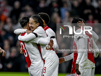 AFC Ajax Amsterdam forward Steven Berghuis and AFC Ajax Amsterdam midfielder Kian Fitz-Jim celebrate the 5-0 goal during the match between A...