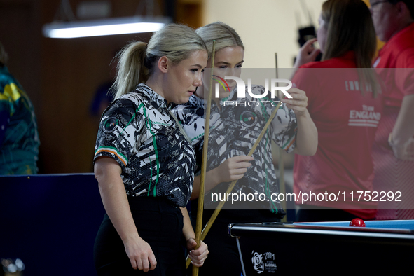 Twin sisters Carrie and Megan Randle from the Blackball Federation of Ireland national ladies doubles team react during a doubles ladies eve...