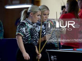 Twin sisters Carrie and Megan Randle from the Blackball Federation of Ireland national ladies doubles team react during a doubles ladies eve...