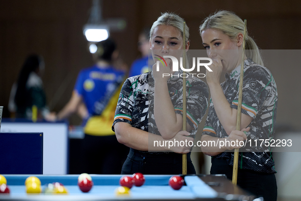 Twin sisters Carrie and Megan Randle from the Blackball Federation of Ireland national ladies doubles team react during a doubles ladies eve...