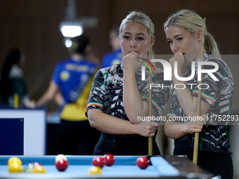 Twin sisters Carrie and Megan Randle from the Blackball Federation of Ireland national ladies doubles team react during a doubles ladies eve...