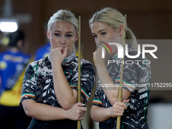 Twin sisters Carrie and Megan Randle from the Blackball Federation of Ireland national ladies doubles team react during a doubles ladies eve...