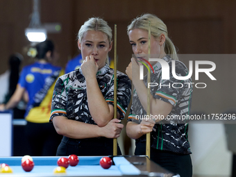 Twin sisters Carrie and Megan Randle from the Blackball Federation of Ireland national ladies doubles team react during a doubles ladies eve...