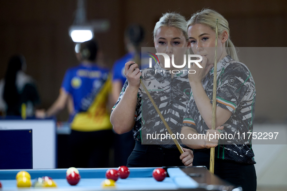 Twin sisters Carrie and Megan Randle from the Blackball Federation of Ireland national ladies doubles team react during a doubles ladies eve...