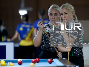 Twin sisters Carrie and Megan Randle from the Blackball Federation of Ireland national ladies doubles team react during a doubles ladies eve...