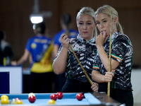 Twin sisters Carrie and Megan Randle from the Blackball Federation of Ireland national ladies doubles team react during a doubles ladies eve...