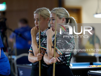 Twin sisters Megan and Carrie Randle from the Blackball Federation of Ireland national ladies doubles team react during a doubles ladies eve...