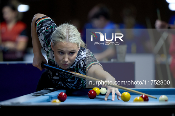 Twin sisters Carrie Randle from the Blackball Federation of Ireland national ladies doubles team perform during a doubles ladies event at th...