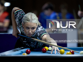 Twin sisters Carrie Randle from the Blackball Federation of Ireland national ladies doubles team perform during a doubles ladies event at th...