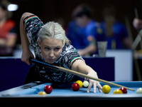 Twin sisters Carrie Randle from the Blackball Federation of Ireland national ladies doubles team perform during a doubles ladies event at th...