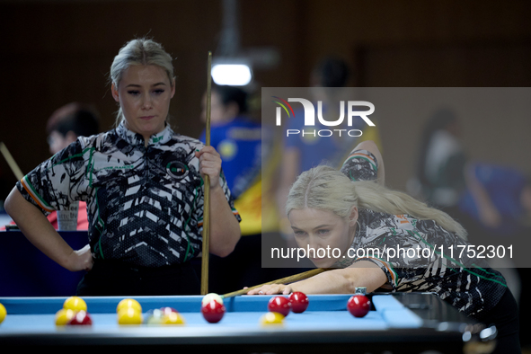 Twin sisters Carrie and Megan Randle from the Blackball Federation of Ireland national ladies doubles team perform during a doubles ladies e...