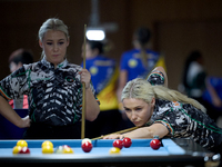 Twin sisters Carrie and Megan Randle from the Blackball Federation of Ireland national ladies doubles team perform during a doubles ladies e...