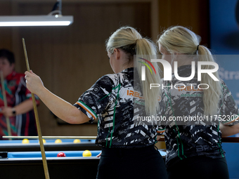 Twin sisters Carrie and Megan Randle from the Blackball Federation of Ireland national ladies doubles team react during a doubles ladies eve...