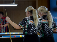 Twin sisters Carrie and Megan Randle from the Blackball Federation of Ireland national ladies doubles team react during a doubles ladies eve...