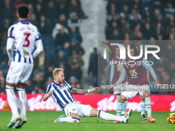 #20, Uros Racic of WBA gets his toe to the ball to deny #30, Luca Koleosho of Burnley possession during the Sky Bet Championship match betwe...