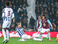 #20, Uros Racic of WBA gets his toe to the ball to deny #30, Luca Koleosho of Burnley possession during the Sky Bet Championship match betwe...