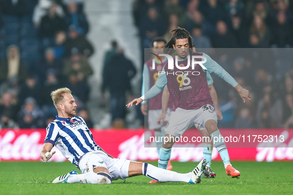 #20, Uros Racic of WBA gets his toe to the ball to deny #30, Luca Koleosho of Burnley possession during the Sky Bet Championship match betwe...