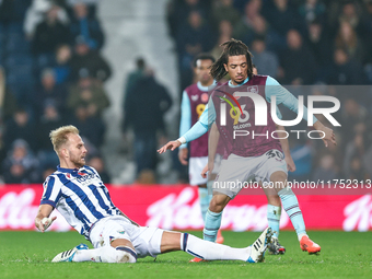 #20, Uros Racic of WBA gets his toe to the ball to deny #30, Luca Koleosho of Burnley possession during the Sky Bet Championship match betwe...