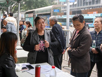 Job seekers learn about employment at a job fair in Chongqing, China, on November 7, 2024. (