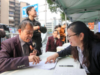 Job seekers learn about employment at a job fair in Chongqing, China, on November 7, 2024. (