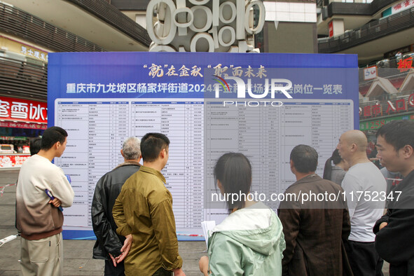 Job seekers learn about employment at a job fair in Chongqing, China, on November 7, 2024. 