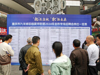 Job seekers learn about employment at a job fair in Chongqing, China, on November 7, 2024. (