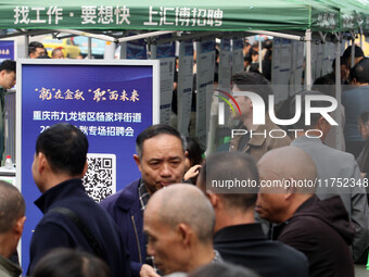 Job seekers learn about employment at a job fair in Chongqing, China, on November 7, 2024. (