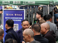 Job seekers learn about employment at a job fair in Chongqing, China, on November 7, 2024. (