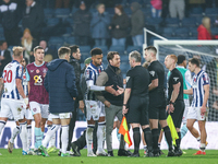 Scott Parker, manager of Burnley, speaks to the officials following the final whistle during the Sky Bet Championship match between West Bro...