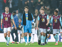 Maxime Esteve (#5), James Trafford (#1), and Zian Flemming (#19) of Burnley pose post-match during the Sky Bet Championship match between We...