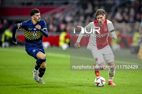 Maccabi Tel Aviv forward Dor Turgeman and AFC Ajax Amsterdam forward Mika Godts play during the match between Ajax and Maccabi Tel Aviv at t...