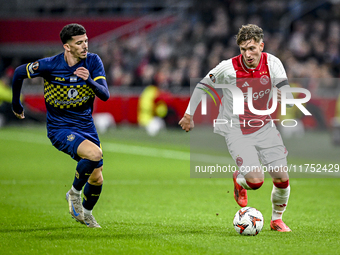 Maccabi Tel Aviv forward Dor Turgeman and AFC Ajax Amsterdam forward Mika Godts play during the match between Ajax and Maccabi Tel Aviv at t...