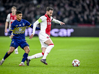 Maccabi Tel Aviv midfielder Sagiv Jehezkel and AFC Ajax Amsterdam midfielder Branco van den Boomen play during the match between Ajax and Ma...