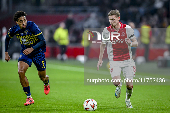 Maccabi Tel Aviv defender Tyrese Asante and AFC Ajax Amsterdam midfielder Kenneth Taylor participate in the match between Ajax and Maccabi T...