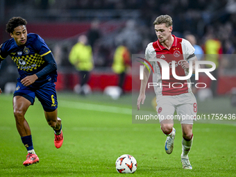 Maccabi Tel Aviv defender Tyrese Asante and AFC Ajax Amsterdam midfielder Kenneth Taylor participate in the match between Ajax and Maccabi T...