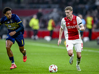 Maccabi Tel Aviv defender Tyrese Asante and AFC Ajax Amsterdam midfielder Kenneth Taylor participate in the match between Ajax and Maccabi T...