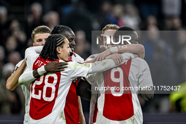 AFC Ajax Amsterdam midfielder Kenneth Taylor and AFC Ajax Amsterdam forward Brian Brobbey celebrate a goal during the match between Ajax and...