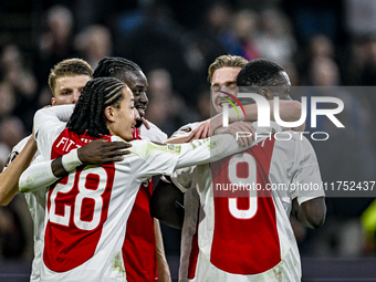 AFC Ajax Amsterdam midfielder Kenneth Taylor and AFC Ajax Amsterdam forward Brian Brobbey celebrate a goal during the match between Ajax and...