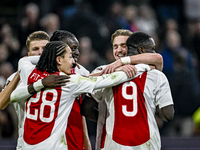 AFC Ajax Amsterdam midfielder Kenneth Taylor and AFC Ajax Amsterdam forward Brian Brobbey celebrate a goal during the match between Ajax and...