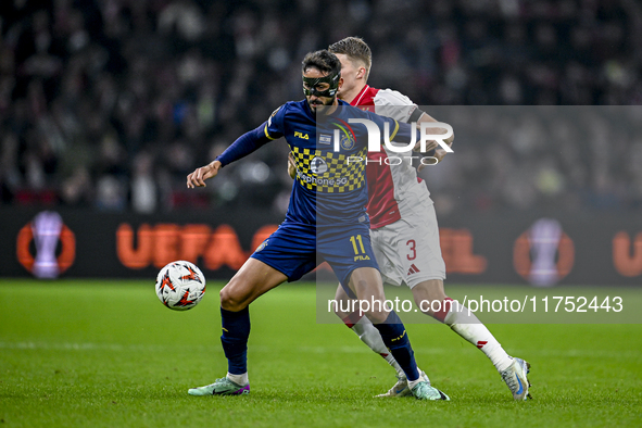 Maccabi Tel Aviv midfielder Sagiv Jehezkel and AFC Ajax Amsterdam defender Anton Gaaei play during the match between Ajax and Maccabi Tel Av...