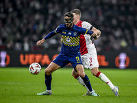 Maccabi Tel Aviv midfielder Sagiv Jehezkel and AFC Ajax Amsterdam defender Anton Gaaei play during the match between Ajax and Maccabi Tel Av...