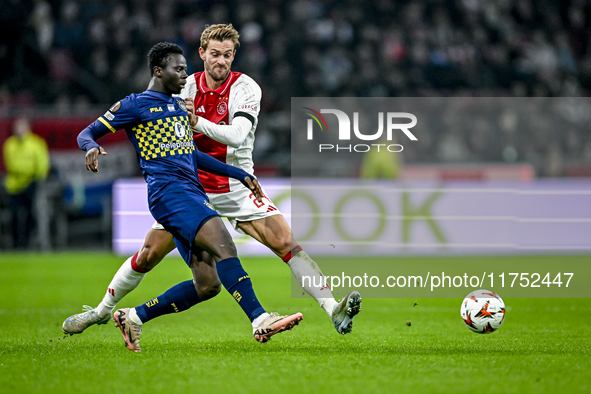 Maccabi Tel Aviv forward Henry Addo and AFC Ajax Amsterdam defender Daniele Rugani play during the match between Ajax and Maccabi Tel Aviv a...